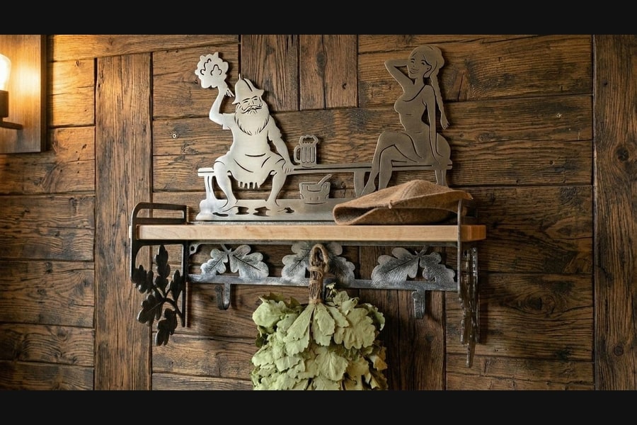 Bath shelf hanger on a wooden wall with sauna accessories